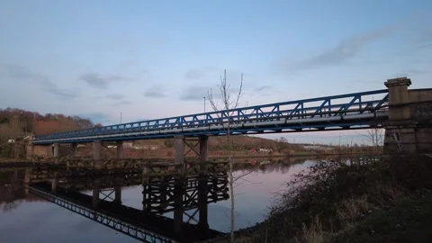 Newburn Bridge on River Tyne. A bridge spans river at dusk Stock Footage 296825464