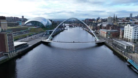 Newcastle Upon Tyne, slowly lifting up over Millenium Bridge as it passes Stock Footage 267053476