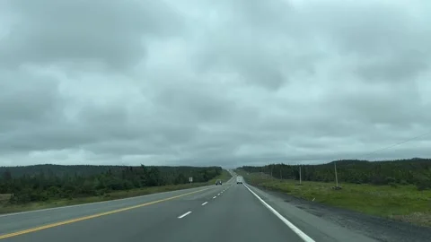 Newfoundland Canada June 21 2026 Driving on highway under overcase sky 스톡 동영상 343190199