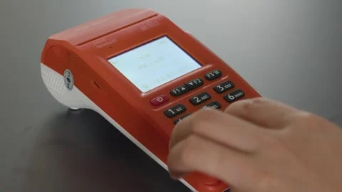 Newland SP610 POS Terminal Processing Payment on Dark Surface Stock Footage 336531691
