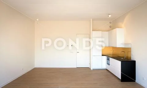 Newly built kitchen in empty living room Stock Photos
