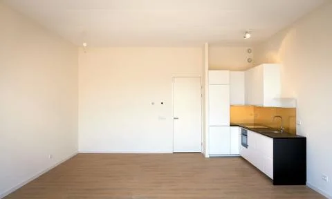 Newly built kitchen in empty living room Stock Photos