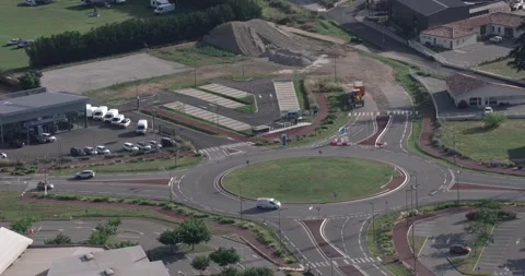 Newly constructed infrastructure, overlooking a roundabout, not much traffic Stock Footage 137402296