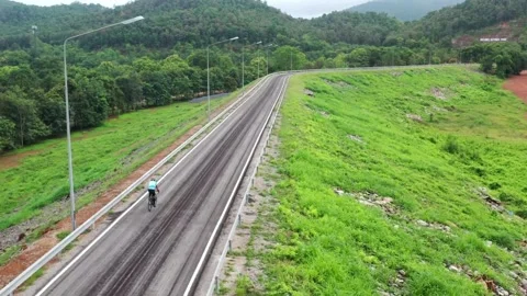 Newly Constructed Road Through Lush Green Hillsides Stock-Footage 311101442