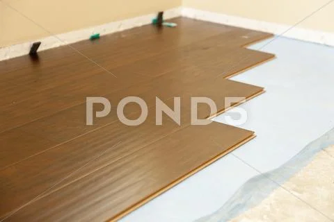 Newly Installed Brown Laminate Flooring Abstract. Stock Photos
