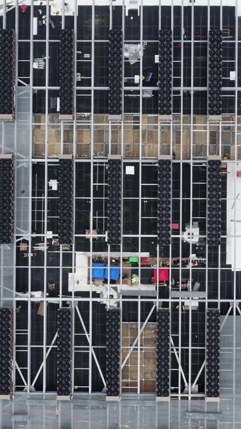 Newly installed cooling units repeat in strict rows on a data center roof under Stock Footage 345728025