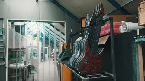 Newly made guitars with different patterns at the factory Stock Footage 274764262