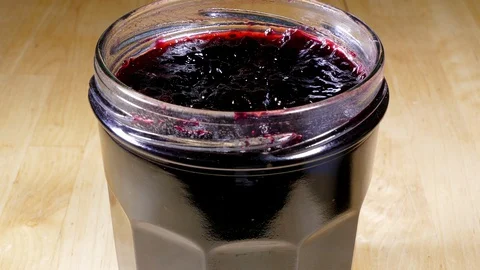 Newly opened jar of blackcurrant fruit jam / jelly / preserve. 스톡 동영상 129147976