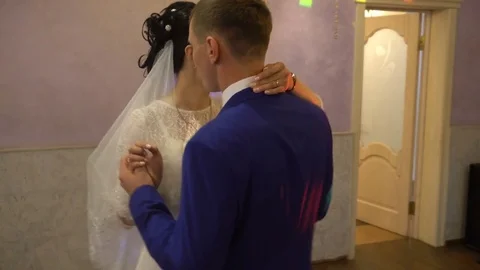 Newlywed couple hugging and dancing on their wedding day Stock Footage