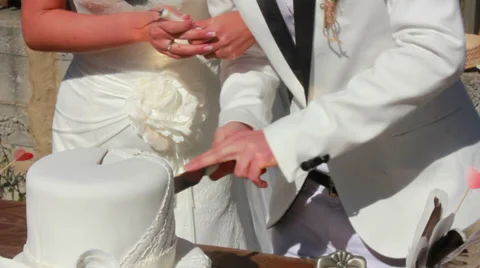 Newlyweds and cake 1 Stock Footage 33653916
