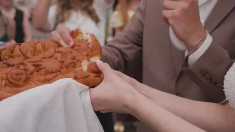 Newlyweds breaking bread, a Slavic tradition Stock Footage 329094582