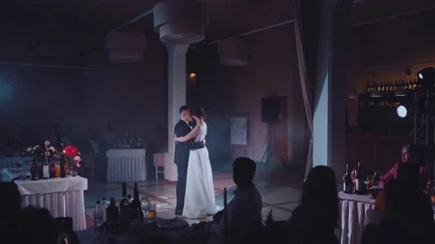 The newlyweds dance the first dance in front of the guests at the wedding Vídeos de archivo 168331041