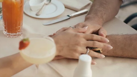 Newlyweds Hold Hands While Sitting In A Cafe. Video stock 106171311