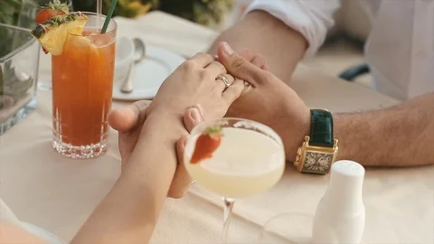 Newlyweds Hold Hands While Sitting In A Cafe. Video stock 106171373