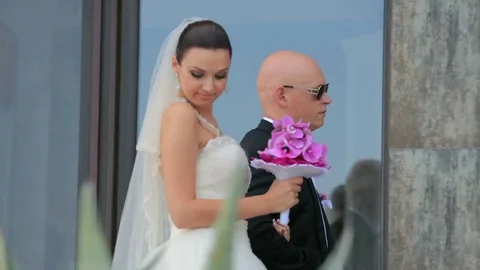 Newlyweds Posing for a holiday Stock-Footage 83344146