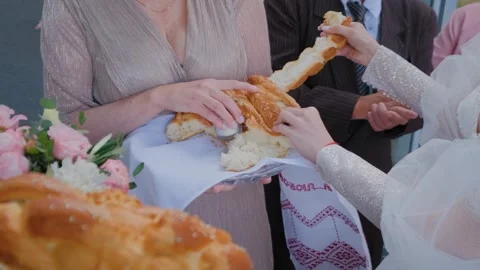 Newlyweds share wedding bread, wedding traditions 스톡 동영상 306155295