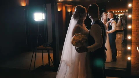 Newlyweds in the studio in front of the mirror Stock Footage 139625214