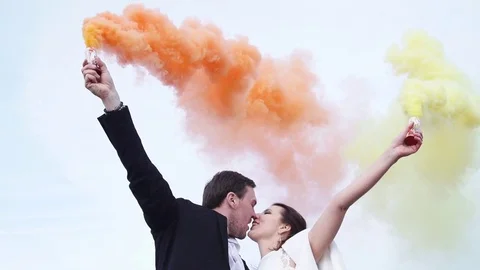 Newlyweds using flares in slow motion Stock Footage 83093875