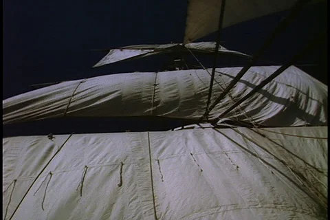 Newport, RI; MS low angle billowing sales of HMS Bounty at night Stock Footage 86751634