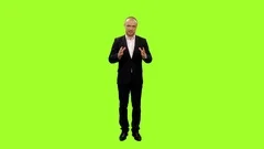 A News Anchorman Gives Report On Green Screen Background Full HD Footage Stock A News Anchorman Gives Report On Green Screen Background Full HD Footage Stock