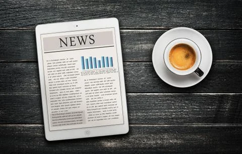 News article on digital tablet and coffee cup Stock Photos