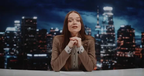 News Host Presents Daily Headlines From modern Television Set 스톡 동영상 332467386