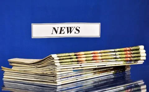 News information-a stack of Newspapers on the table. Stock Photos