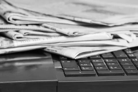 News Newspapers on laptop. Business concept Stock Photos