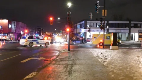 News stringer walking towards accident scene at night with camera in hands 動画素材 104226672