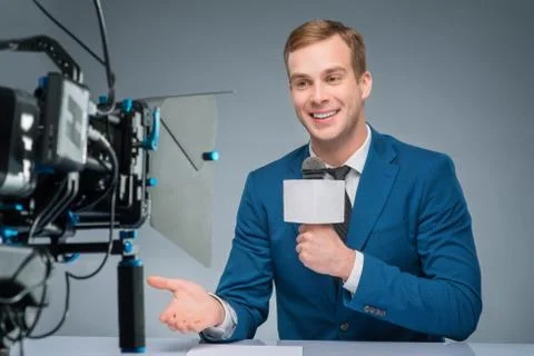 Newsman during broadcasting process Foto stock