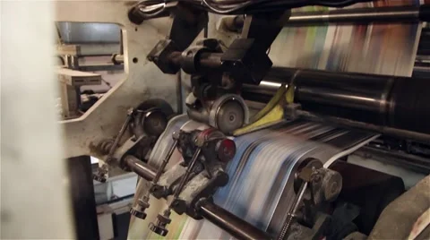 Newspaper being printed on a printing press, steady shot Stock Footage