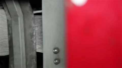 Newspaper being stacked in a printing press Stock Footage 57325168