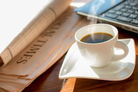 Newspaper with coffee Stock Photos