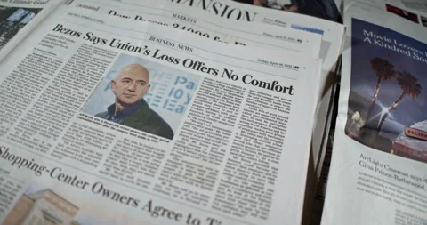 Newspaper Coverage of Amazon Workers Vote Down Union Drive at Alabama Warehouse Stock Footage 154963262