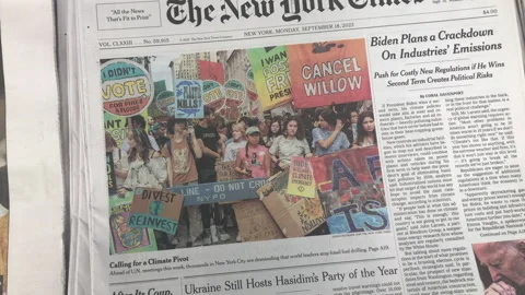 Newspaper Coverage of Climate Change Protest at the U.N. Stock Footage 251390016