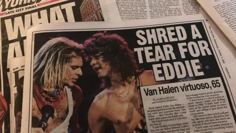 Newspaper coverage of the death of legendary guitarist Eddie Van Halen Stock Footage