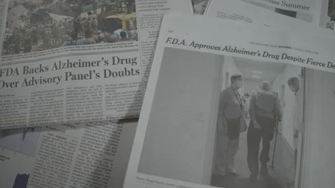 Newspaper Coverage of FDA Grants Accelerated Approval for Alzheimer’s Drug Stock Footage 156762112