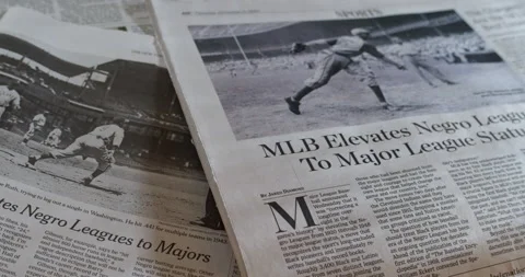 Newspaper Coverage of the Negro baseball league elevated to the Majors. Stock Footage 145815572