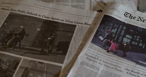 Newspaper coverage of NYC Public schools shutdown due to surge of Covid-19 Stock Footage 144032954