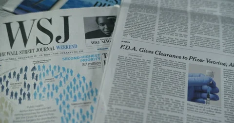 Newspaper coverage of Pfizers Covid Vaccine approved by FDA Stock Footage 144959858