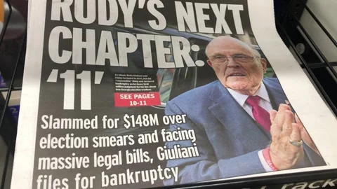 Newspaper Coverage of Rudy Giuliani Declares Chapter 11 Stock Footage 259753068