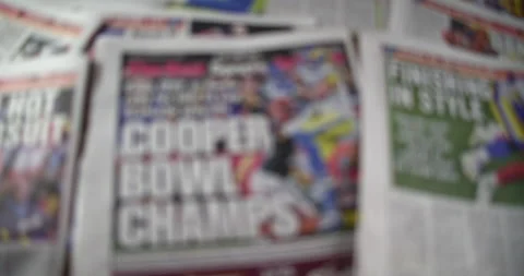 Newspaper Coverage of Super Bowl 56, Rack Focus Front Page Post. Stock Footage 170341683