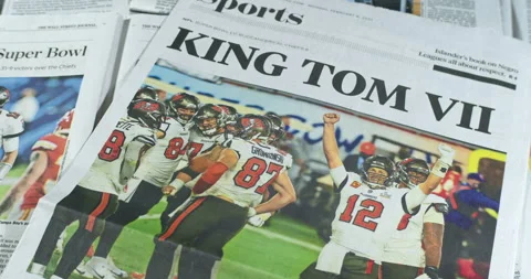 Newspaper Coverage of Tom Brady Winning his seventh Super Bowl with Tampa Stock Footage 148500057