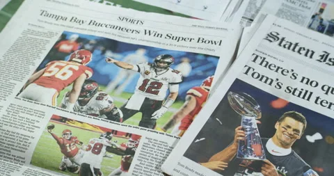 Newspaper Coverage of Tom Brady Winning his seventh Super Bowl with Tampa Stock Footage 148500159