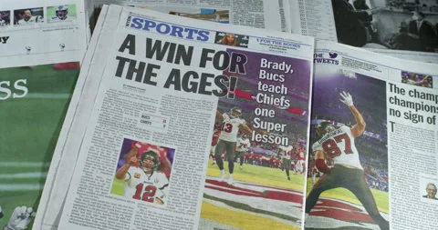 Newspaper Coverage of Tom Brady Winning his seventh Super Bowl with Tampa Stock Footage 148501306