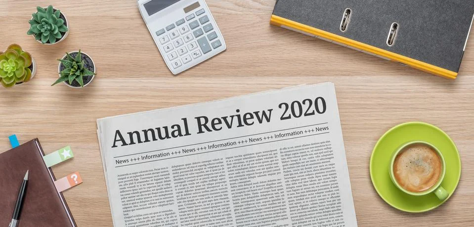 A newspaper on a desk with the headline Annual review 2020 Stock Photos