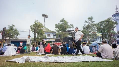 Newspaper garbage is scattered after Eid prayer Stock Photos