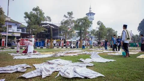 Newspaper garbage is scattered after Eid prayer Stock Photos