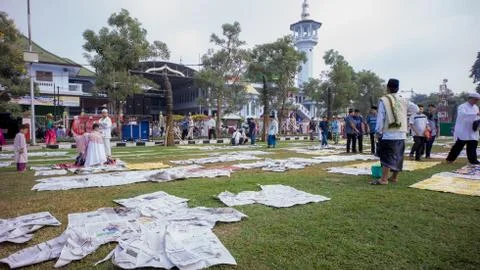 Newspaper garbage is scattered after Eid prayer Stock Photos