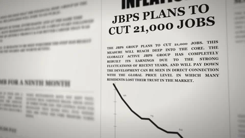 Newspaper page with an inflation headline about job cuts in shallow focus Vídeo Stock 344791124
